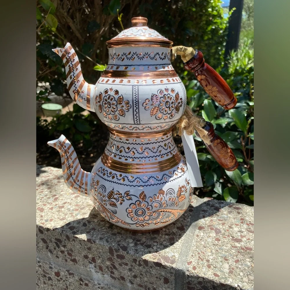 This handmade, white-painted Turkish copper teapot set features traditional